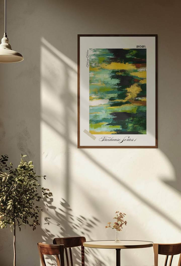 Framed abstract art on a wall with a table and chairs below